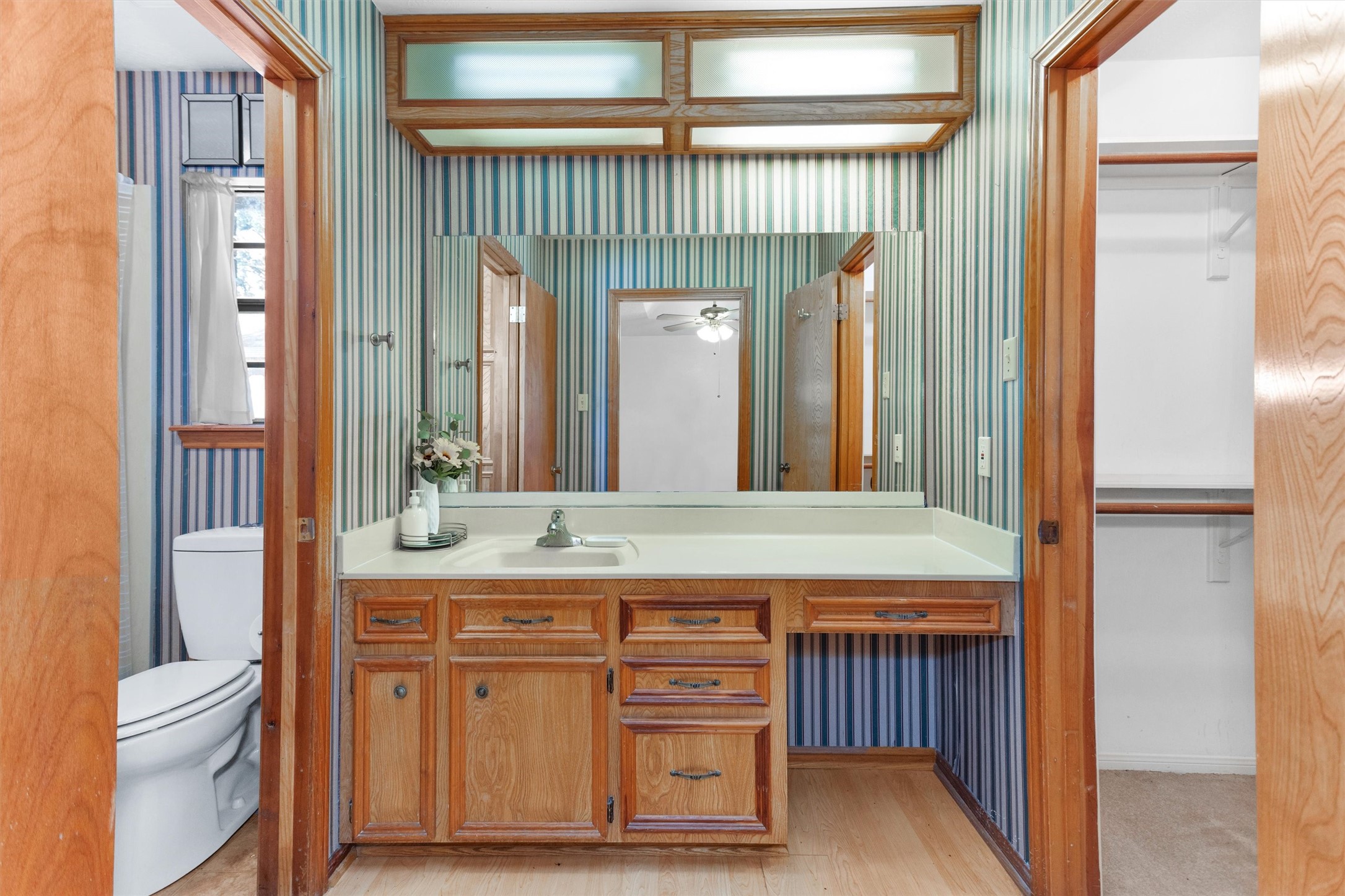 1706 Shawnee Street Navasota, TX 77868 - Photo 15 of 29 a bathroom with a granite countertop sink and a mirror