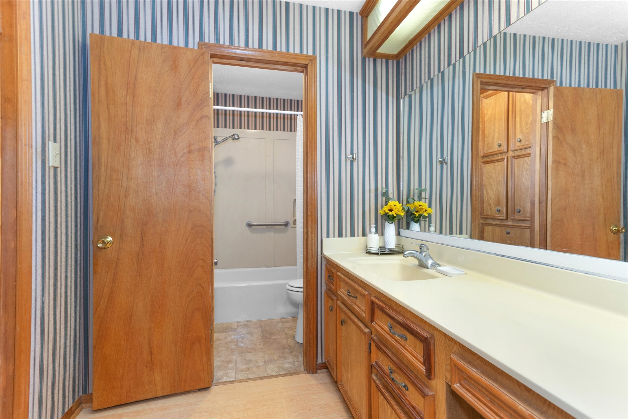 1706 Shawnee Street Navasota, TX 77868 - Photo 16 of 29 a bathroom with a sink and a mirror