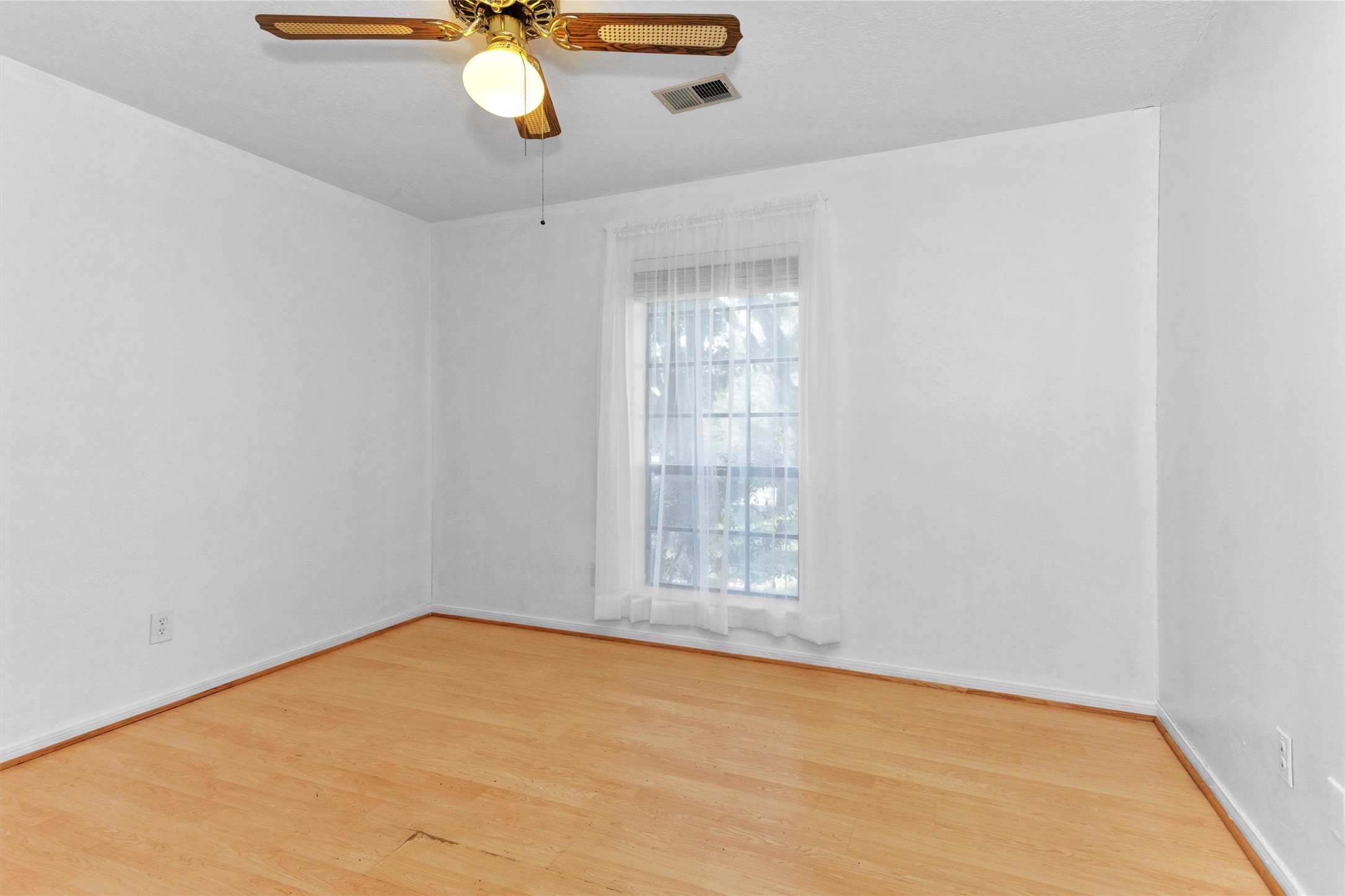 1706 Shawnee Street Navasota, TX 77868 - Photo 18 of 29 a view of an empty room with window