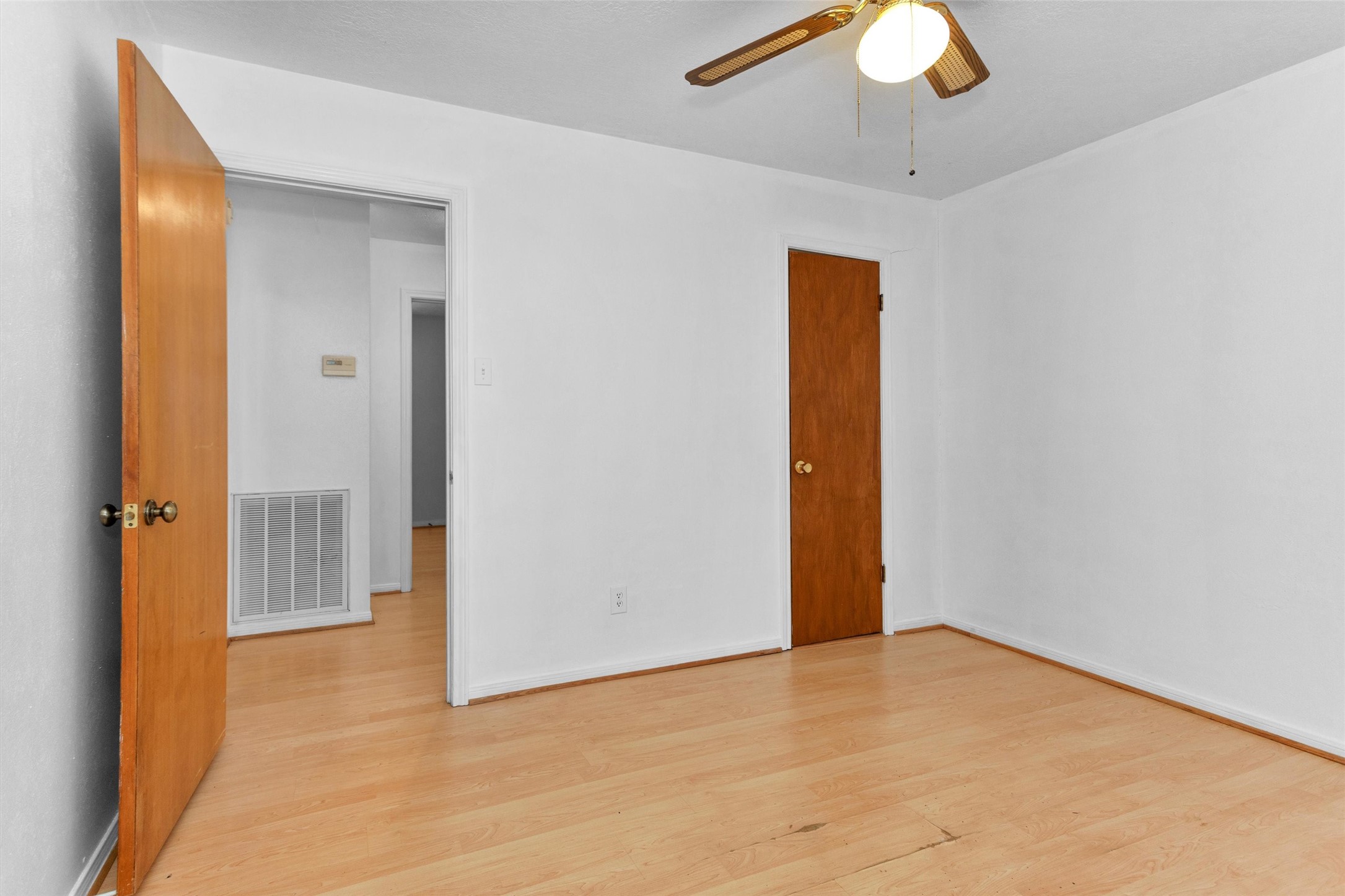 1706 Shawnee Street Navasota, TX 77868 - Photo 19 of 29 a view of an empty room with wooden floor