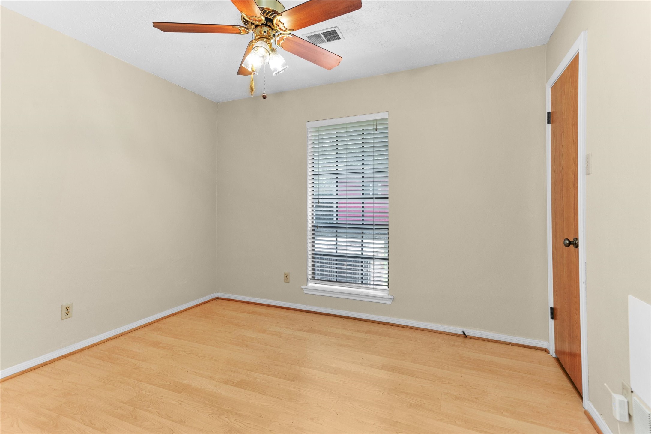 1706 Shawnee Street Navasota, TX 77868 - Photo 21 of 29 a view of an empty room with a window