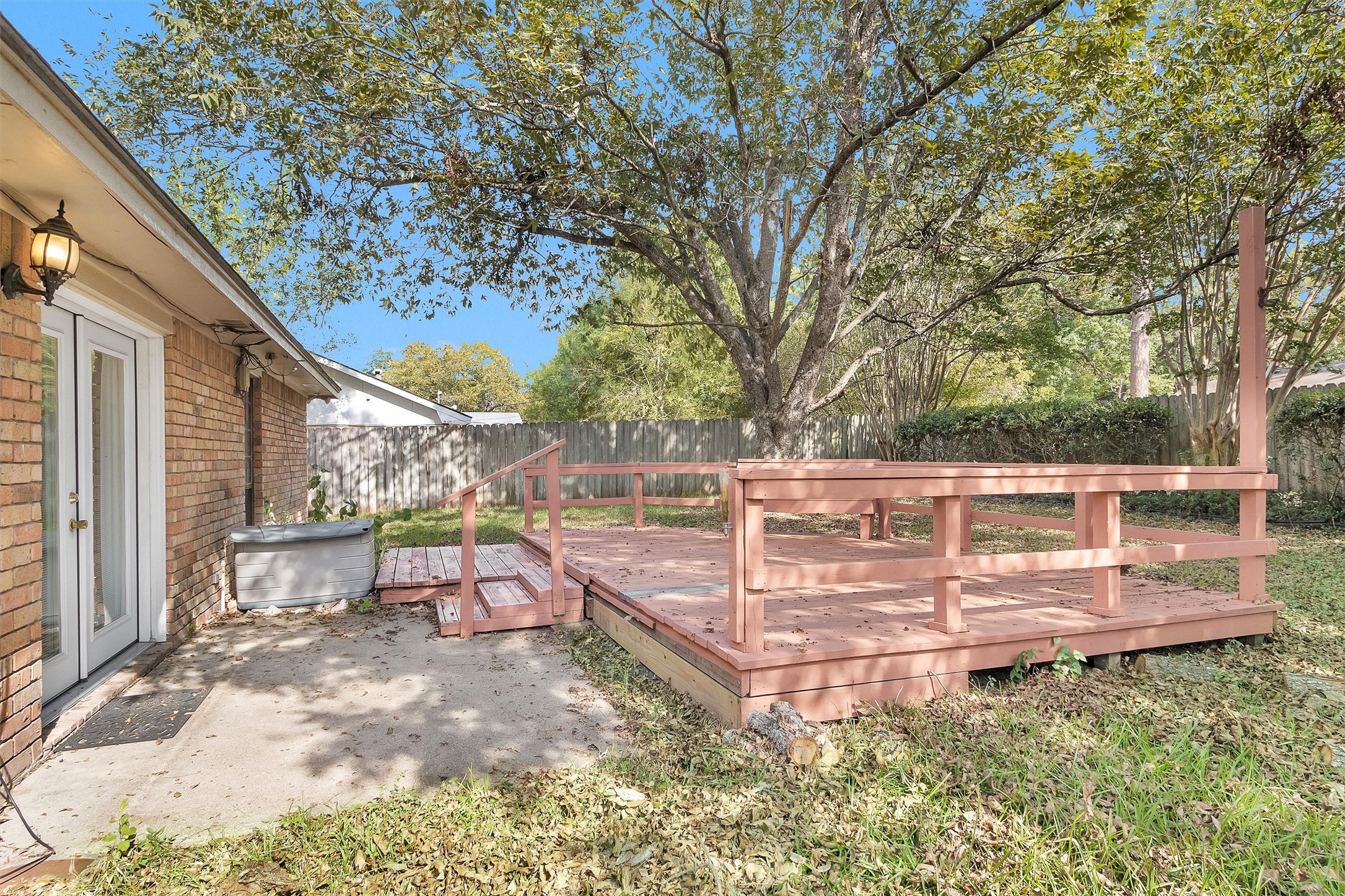 1706 Shawnee Street Navasota, TX 77868 - Photo 24 of 29 a view of a wooden deck and backyard