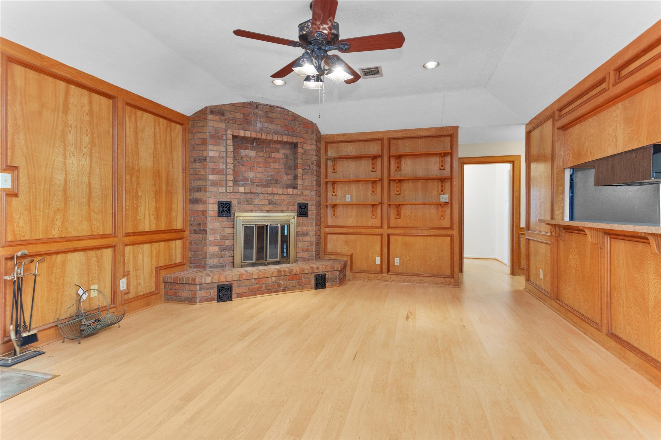 1706 Shawnee Street Navasota, TX 77868 - Photo 8 of 29 a view of an empty room with a fireplace and a window