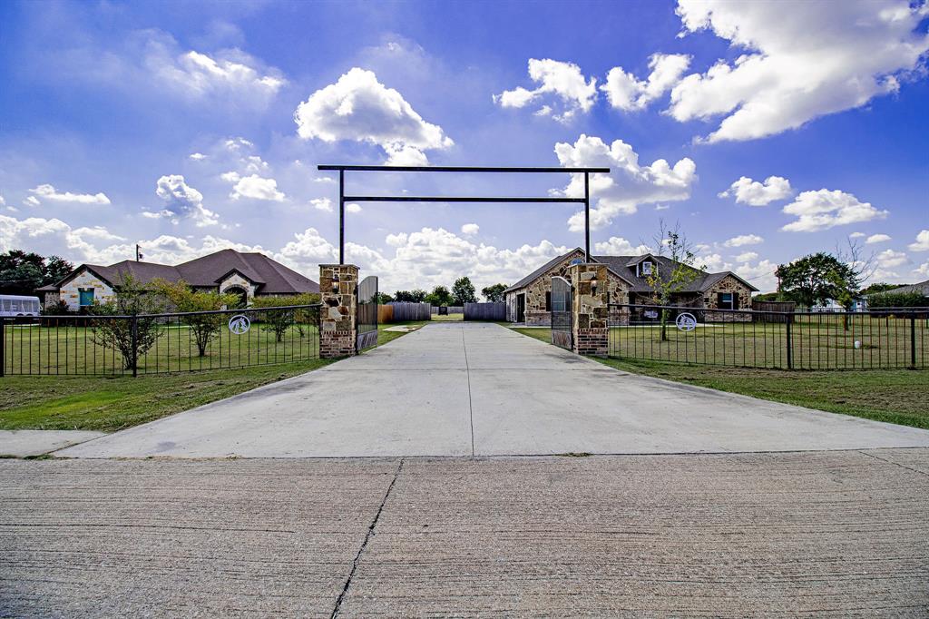 328 Meadow Lane Red Oak, TX 75154 - Photo 27 of 35 View of concrete driveway featuring a gated entry and a gate