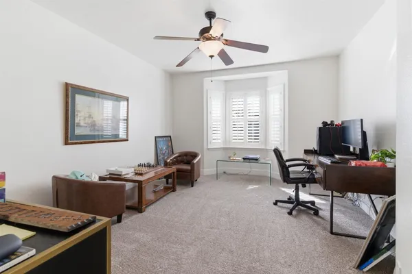 a living room with furniture a fireplace and a table