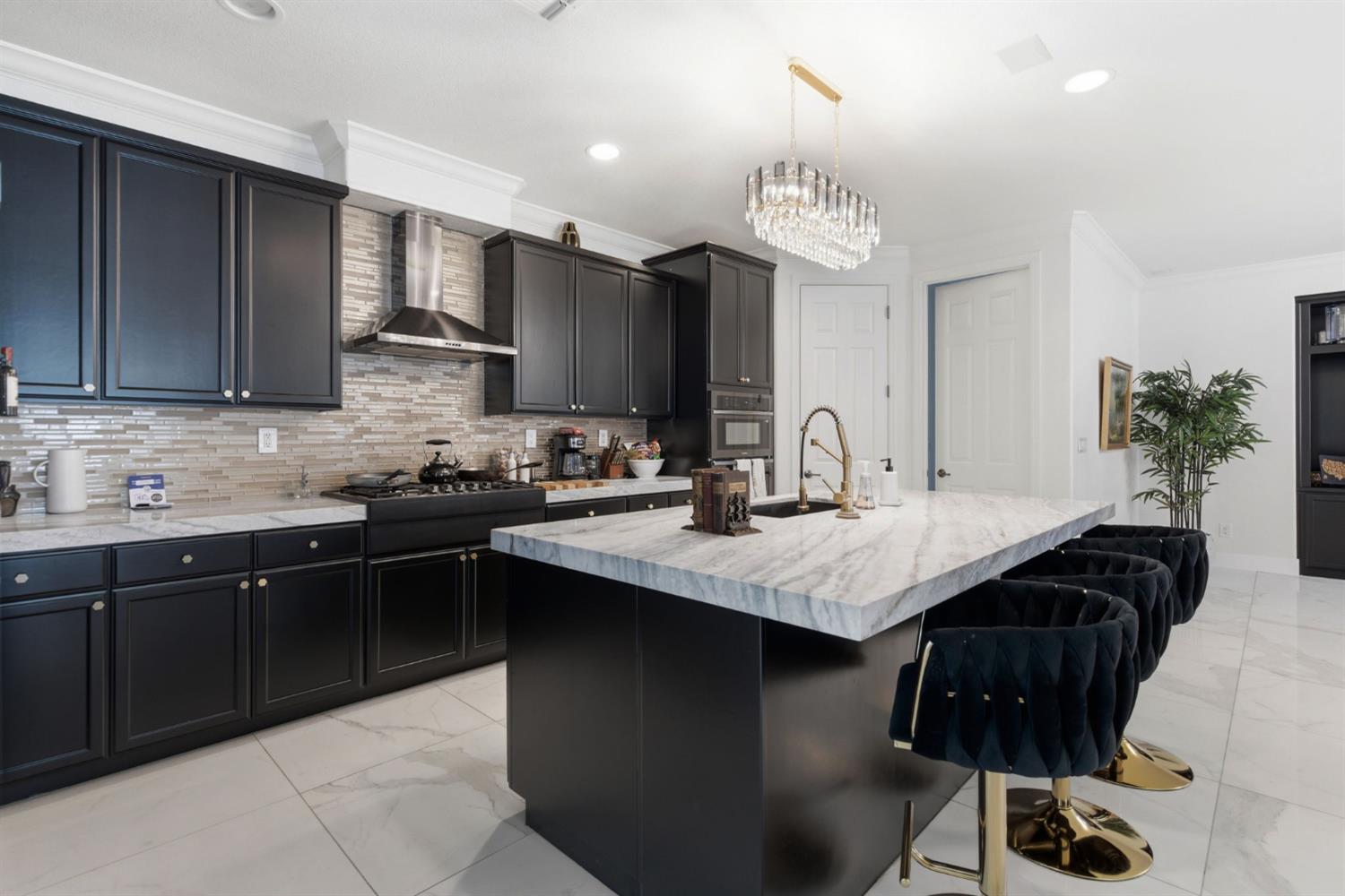 243 John Kamps Way Ripon, CA 95366 - Photo 19 of 62 a kitchen with a sink stainless steel appliances and cabinets