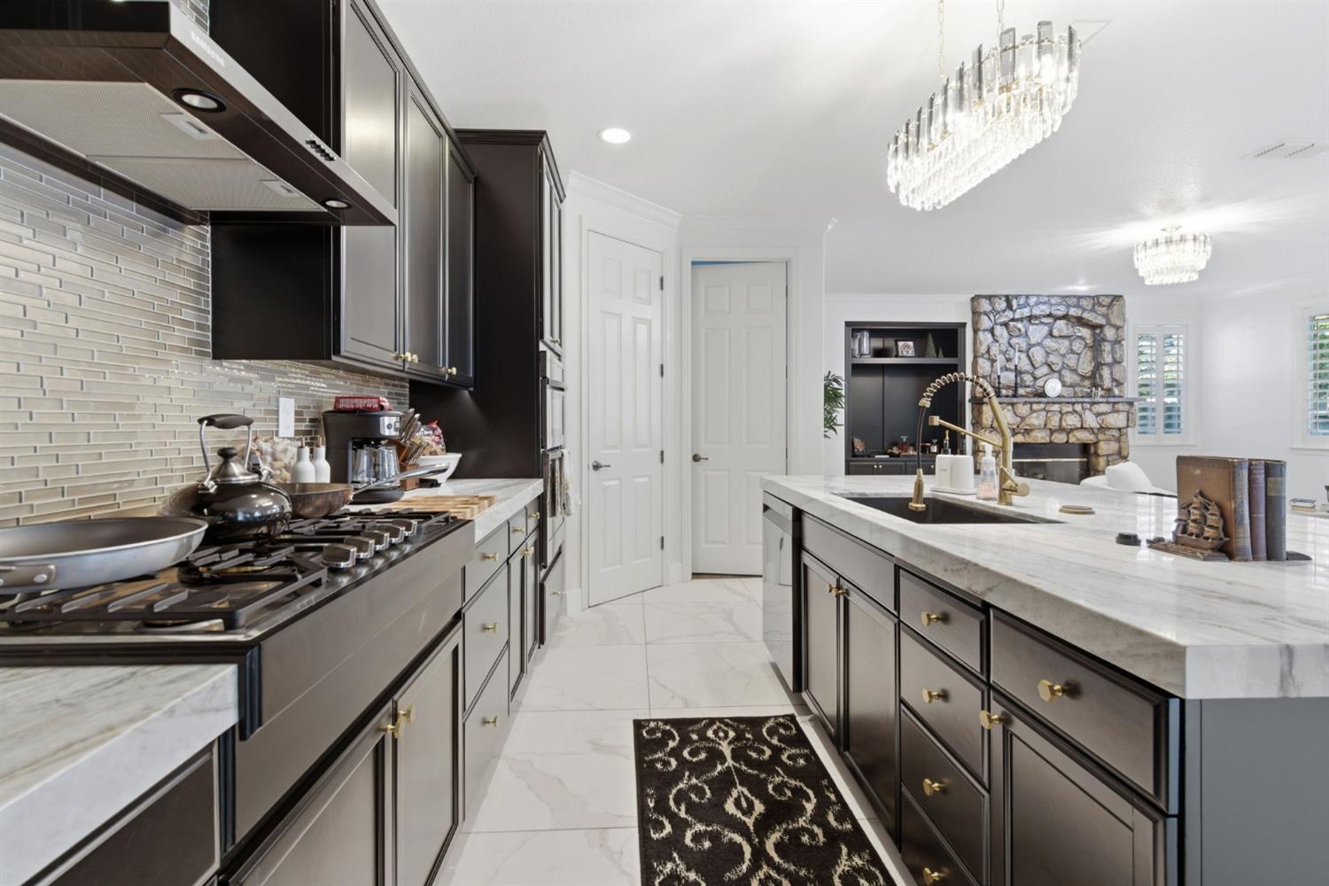 243 John Kamps Way Ripon, CA 95366 - Photo 21 of 62 a kitchen with stainless steel appliances a sink stove and cabinets