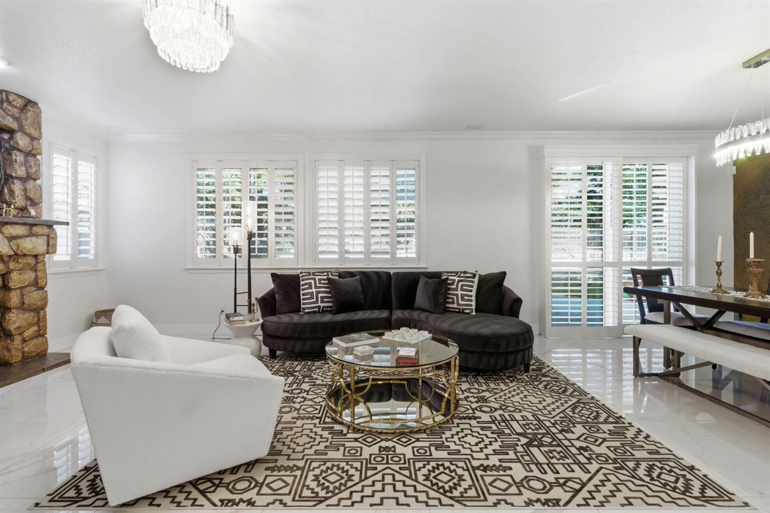 243 John Kamps Way Ripon, CA 95366 - Photo 26 of 62 a living room with furniture a flat screen tv and a large window