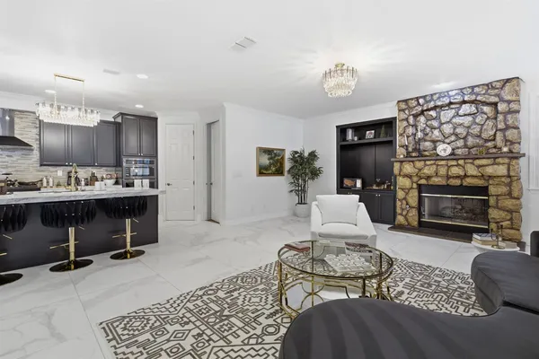 a living room with furniture and a lamp