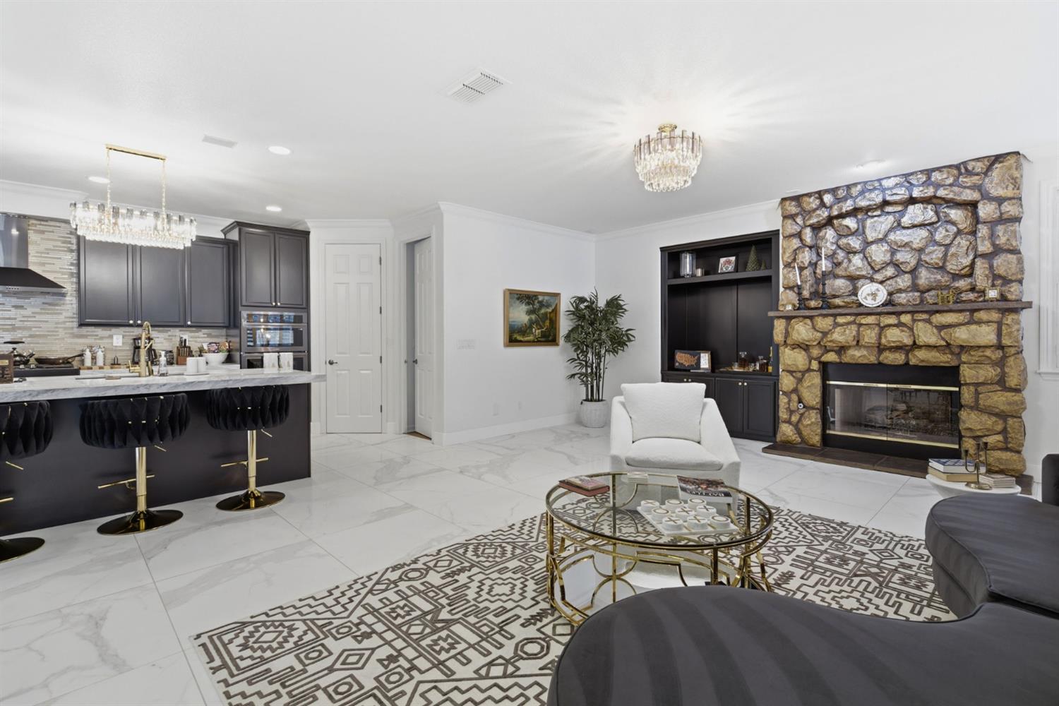 243 John Kamps Way Ripon, CA 95366 - Photo 29 of 62 a living room with furniture a fireplace and a flat screen tv