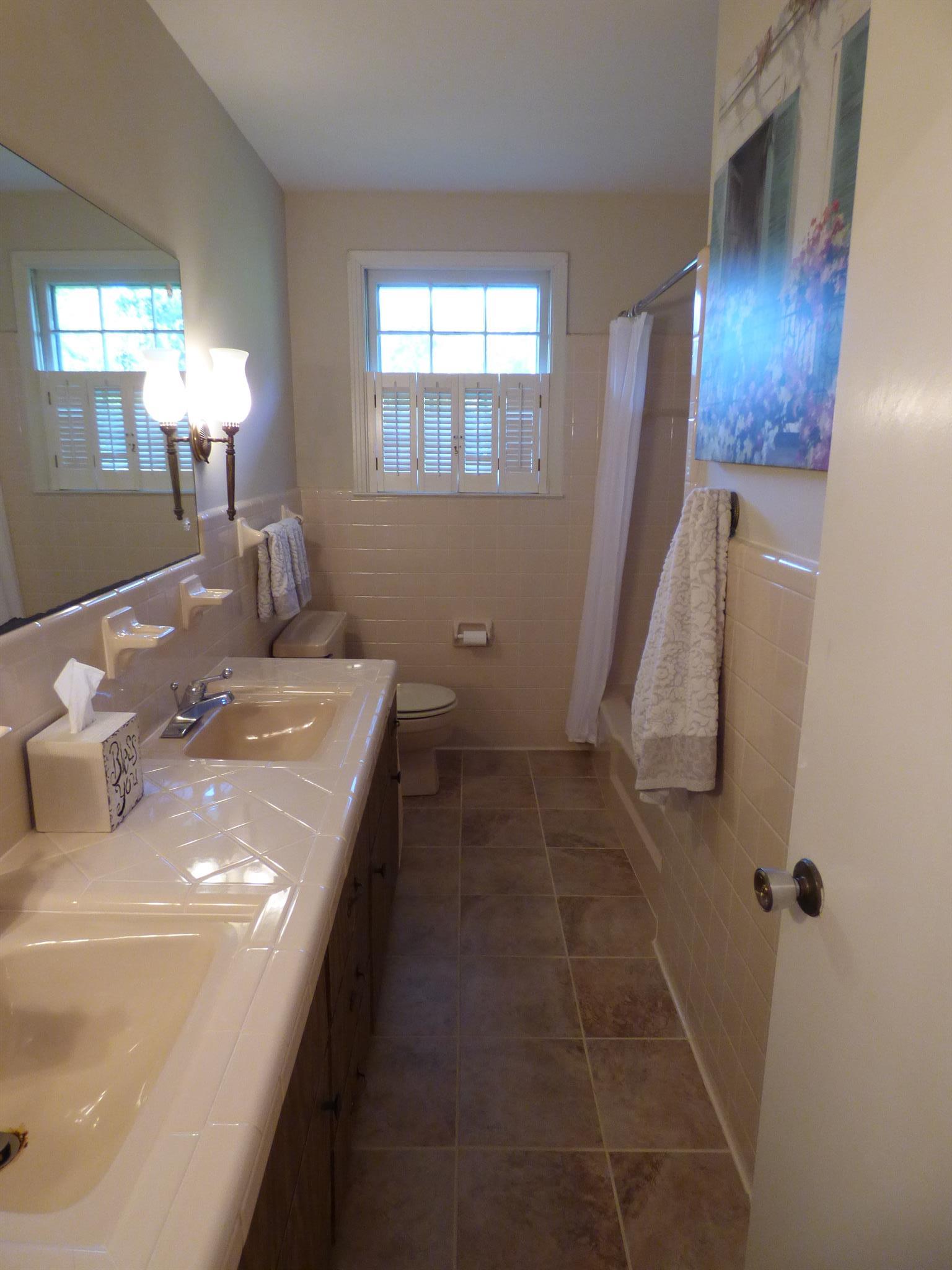 441 Excell Road Clarksville, TN 37043 - Photo 17 of 30 a bathroom with a sink and mirror