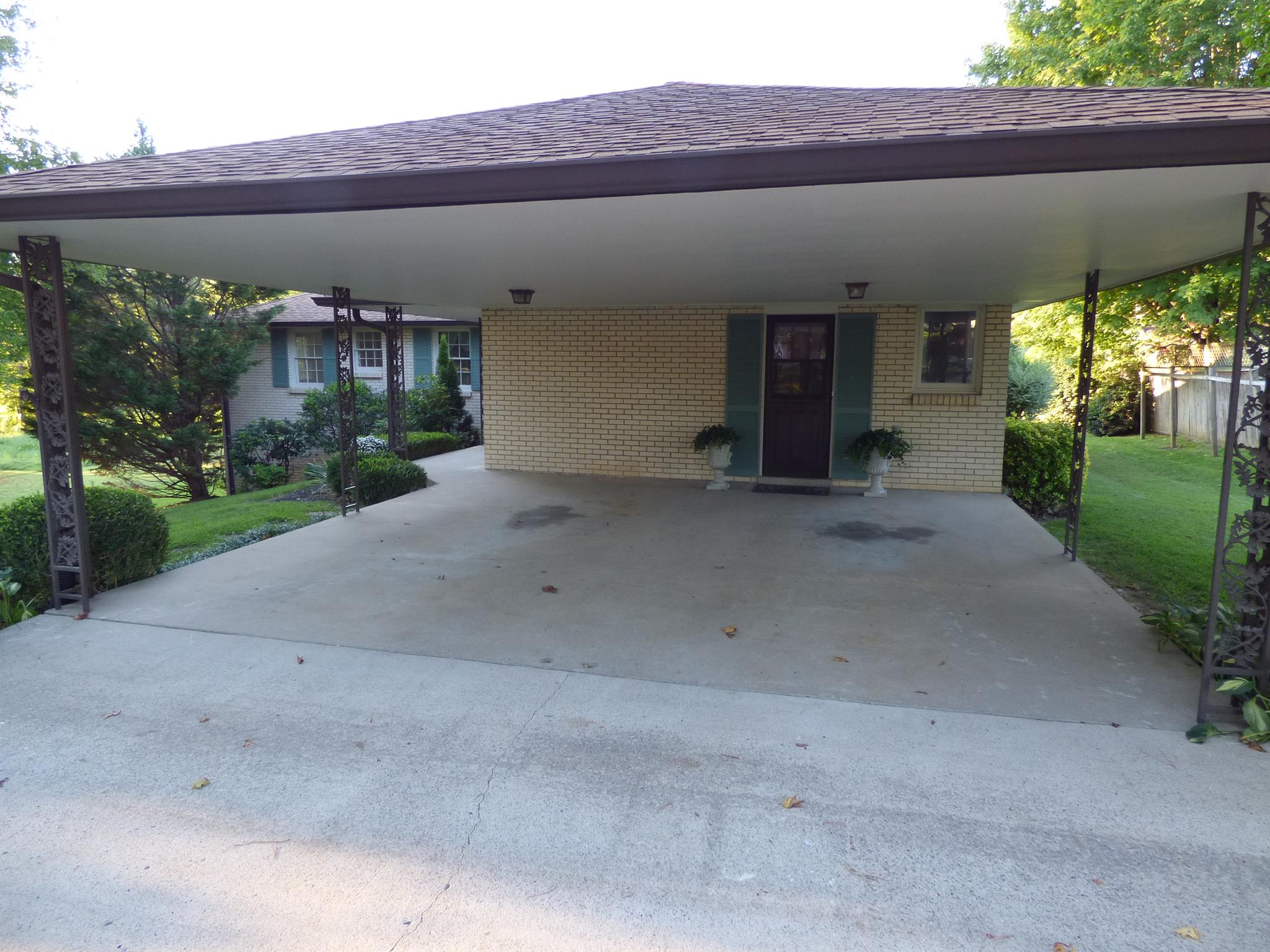 441 Excell Road Clarksville, TN 37043 - Photo 26 of 30 a view of a house with a yard and a garden