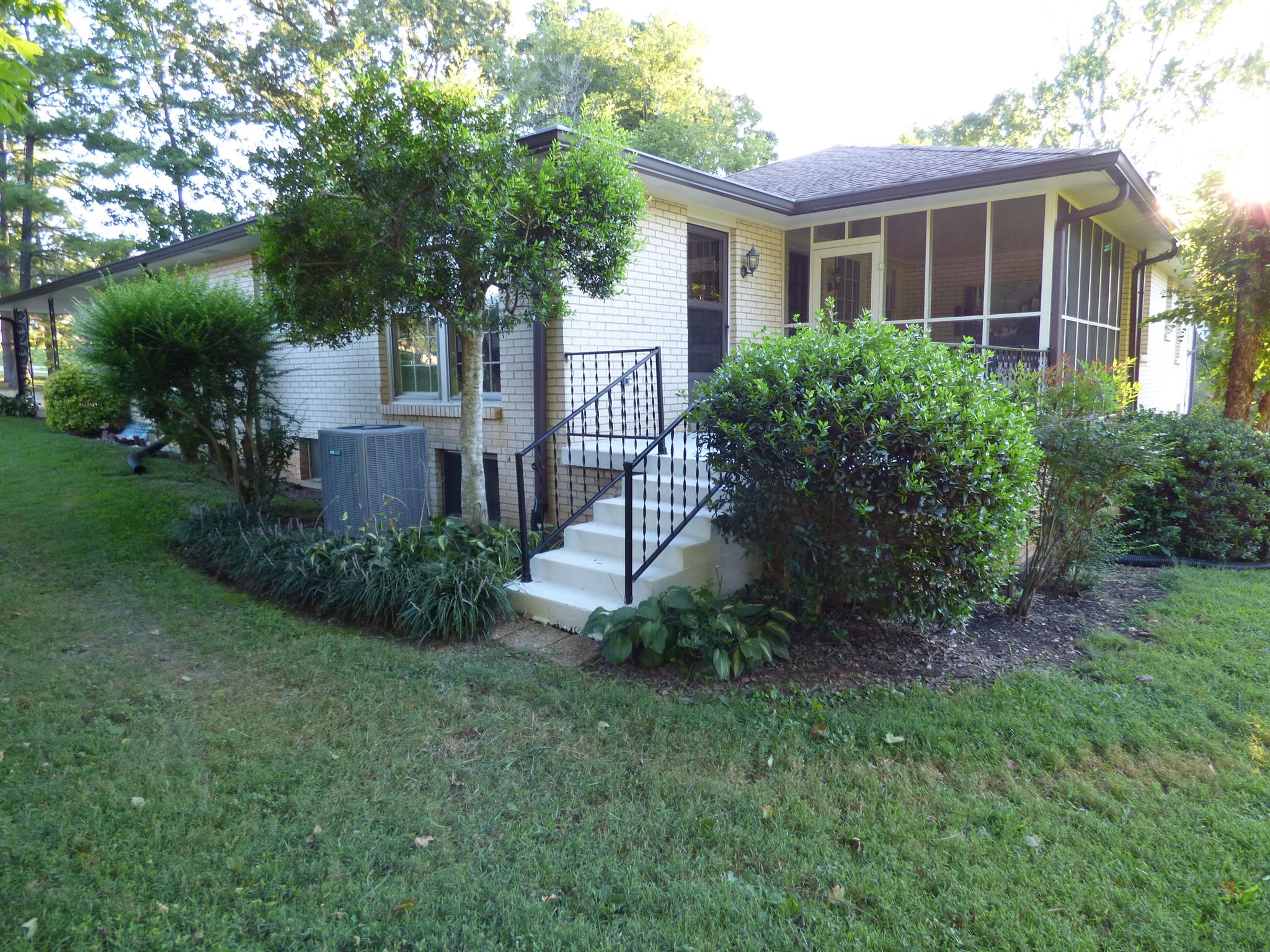 441 Excell Road Clarksville, TN 37043 - Photo 28 of 30 a front view of a house with a garden