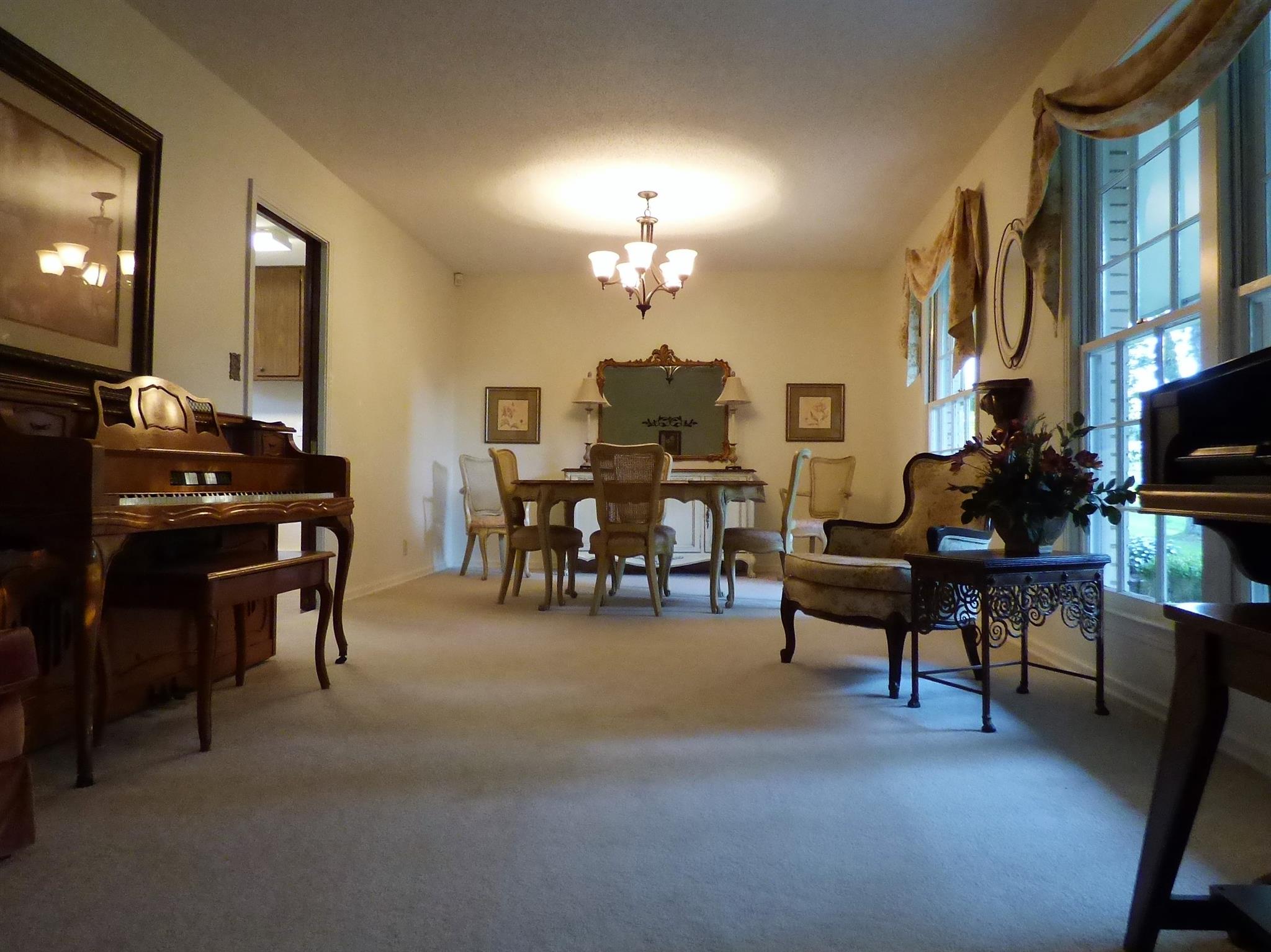 441 Excell Road Clarksville, TN 37043 - Photo 5 of 30 a living room with furniture a piano and a fireplace