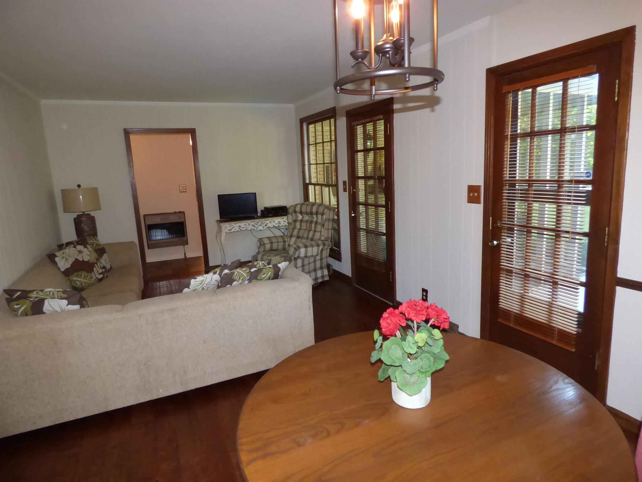 441 Excell Road Clarksville, TN 37043 - Photo 10 of 30 a dining room with kitchen island furniture and chandelier