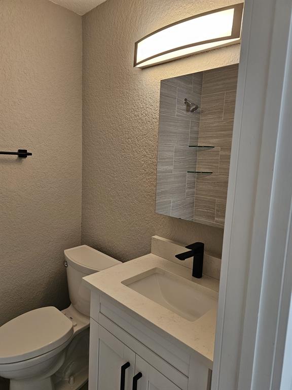 1102 Jeffery Street Boca Raton, FL 33487 - Photo 11 of 14 a bathroom with a sink a toilet