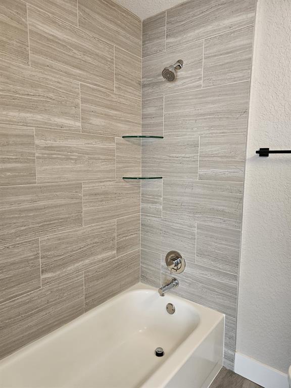 1102 Jeffery Street Boca Raton, FL 33487 - Photo 12 of 14 a bathroom with a bathtub
