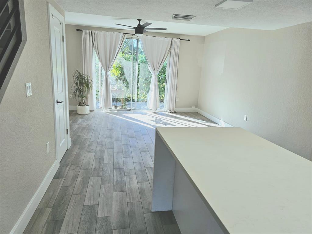 1102 Jeffery Street Boca Raton, FL 33487 - Photo 3 of 14 a view of an entryway with wooden floor