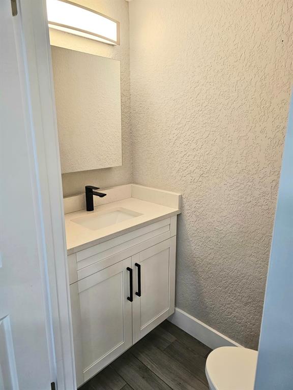 1102 Jeffery Street Boca Raton, FL 33487 - Photo 10 of 14 a bathroom with a sink toilet and vanity