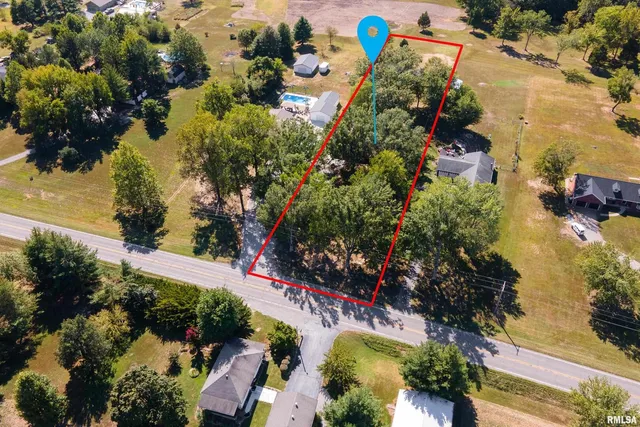 an aerial view of residential house with outdoor space