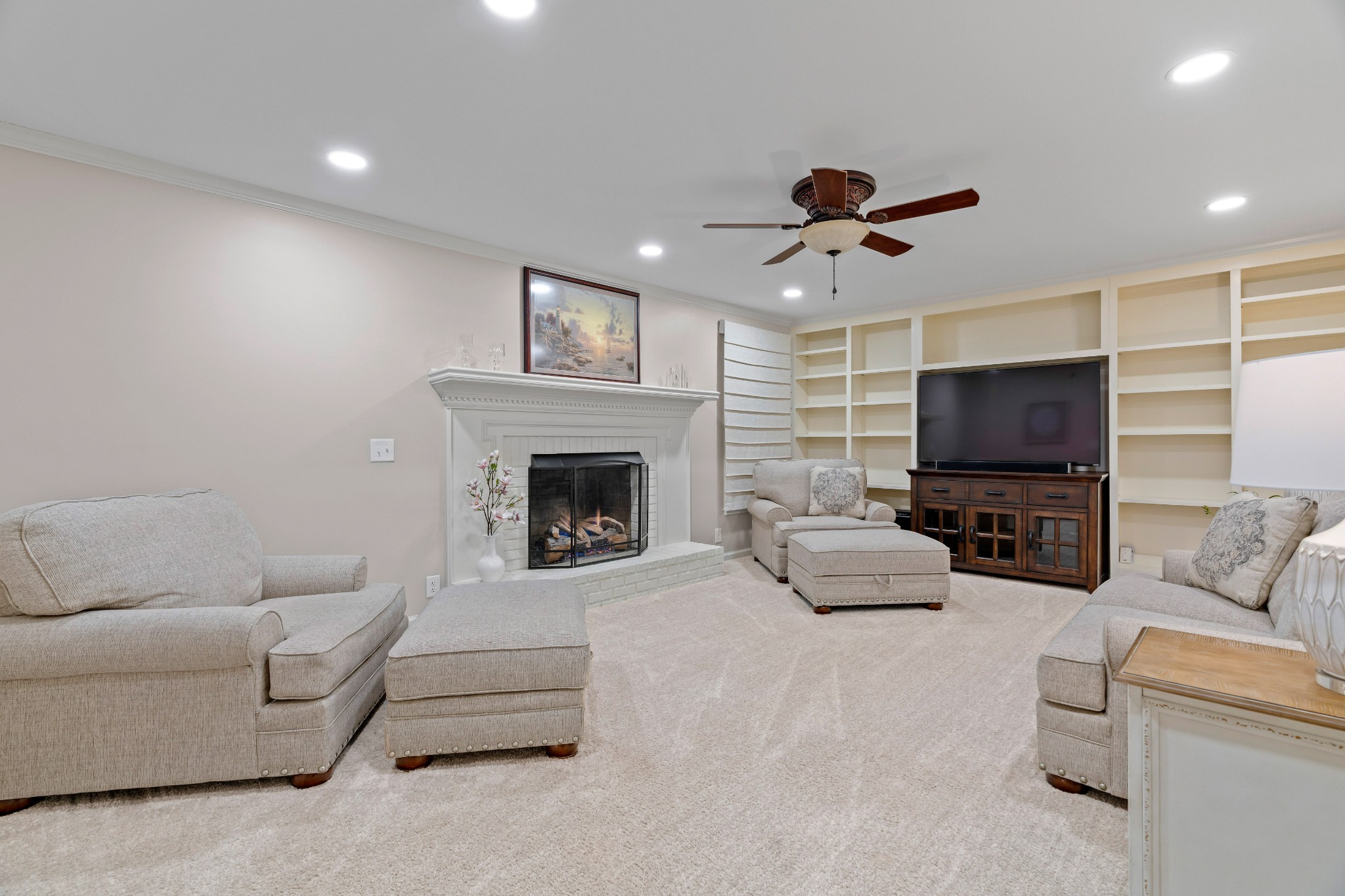 204 Hidden Lake Road Hendersonville, TN 37075 - Photo 18 of 67 a living room with furniture and a fireplace
