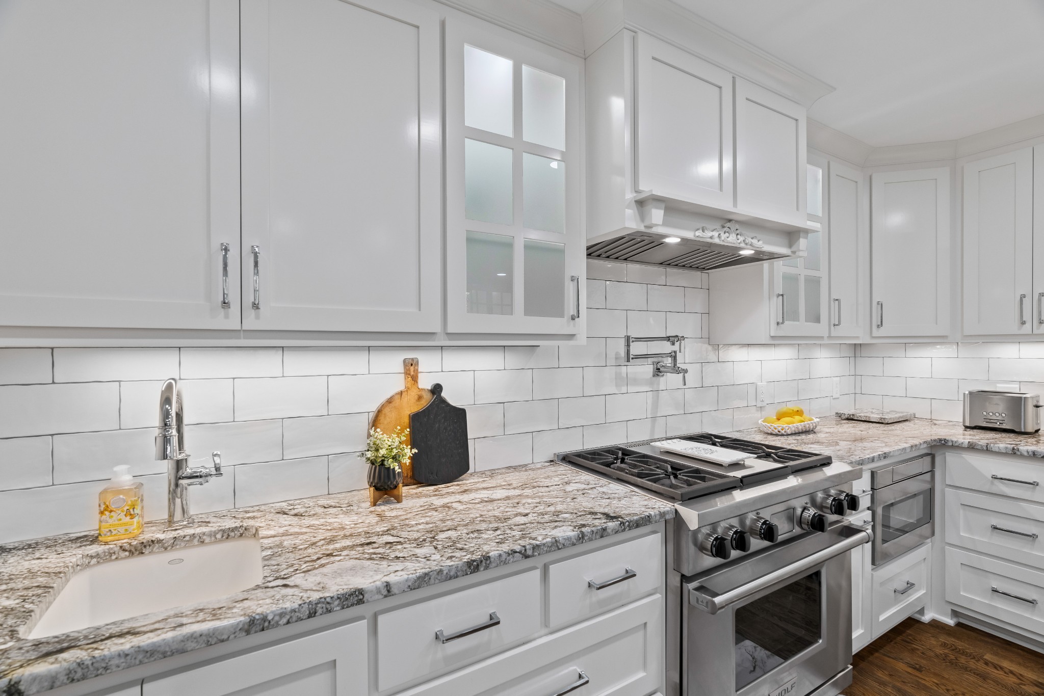 204 Hidden Lake Road Hendersonville, TN 37075 - Photo 25 of 67 a kitchen with stainless steel appliances granite countertop a stove a sink and a white cabinets