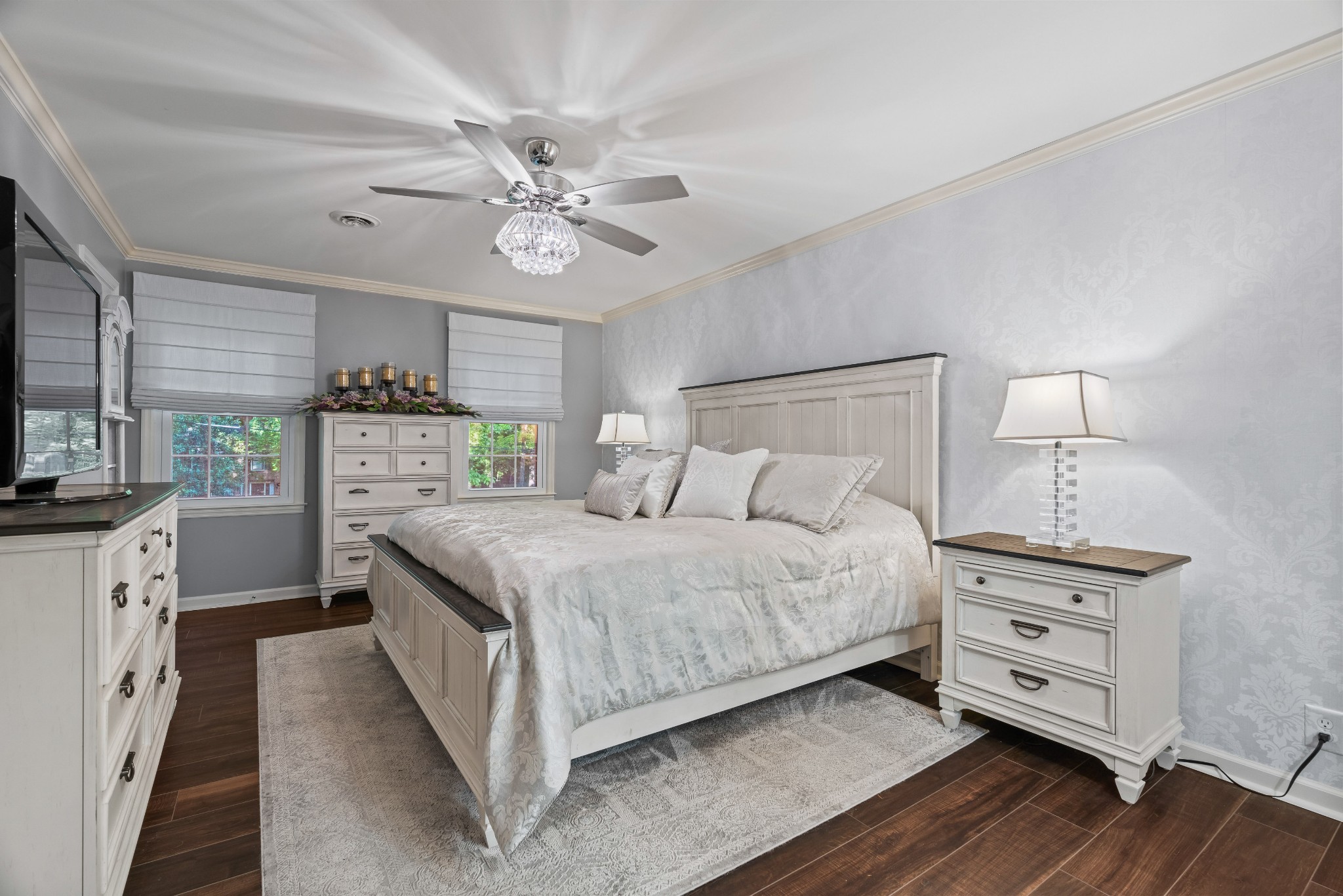 204 Hidden Lake Road Hendersonville, TN 37075 - Photo 37 of 67 a bedroom with a bed and a flat tv screen on dresser