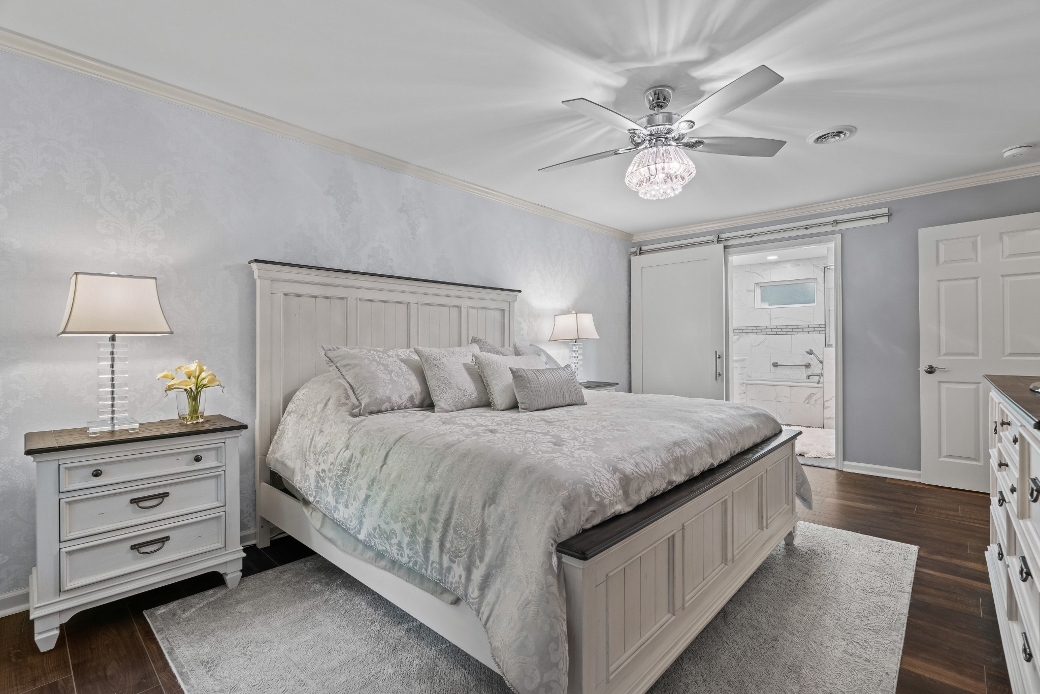 204 Hidden Lake Road Hendersonville, TN 37075 - Photo 38 of 67 a spacious bedroom with a bed and a chandelier