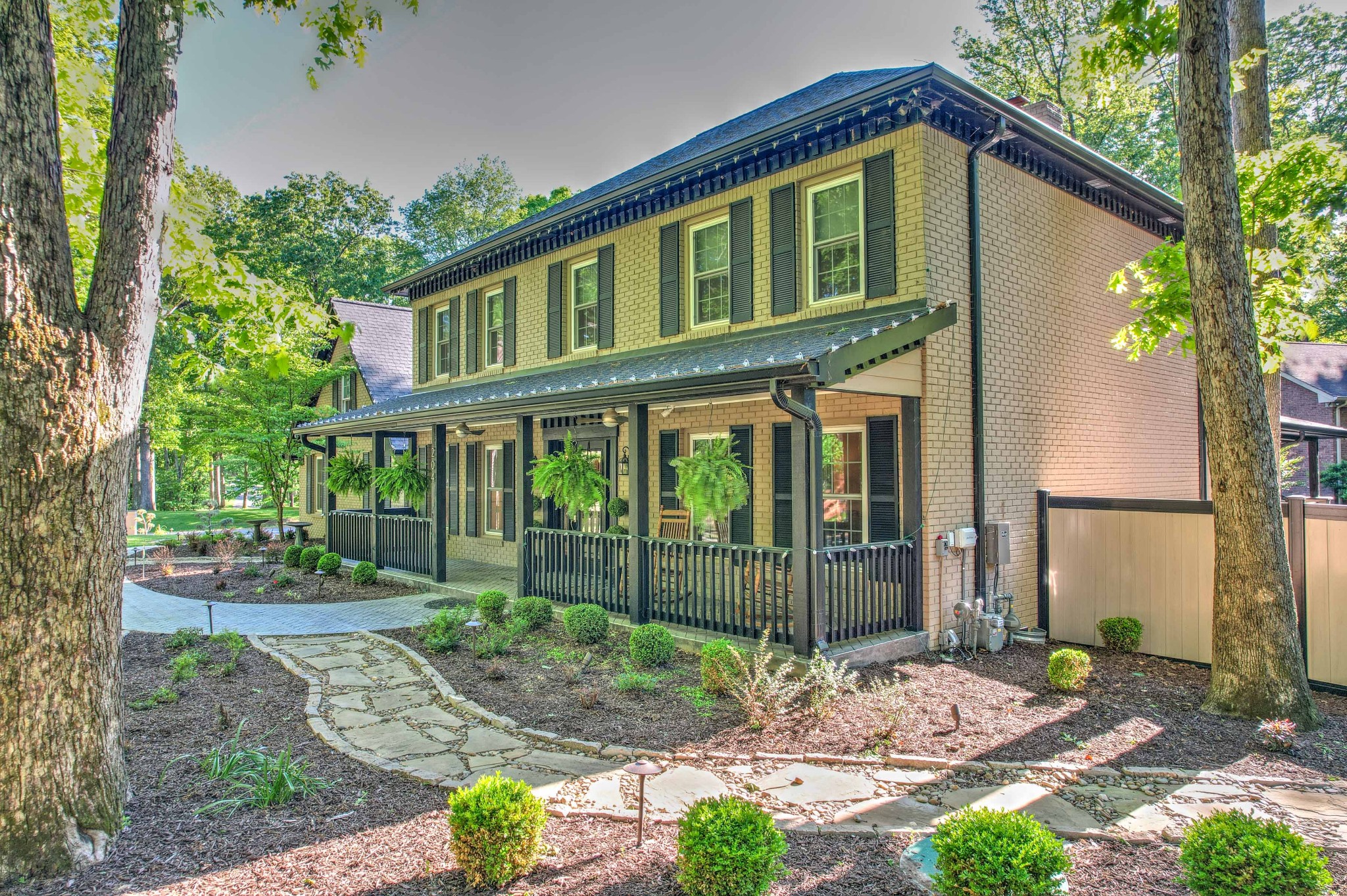 204 Hidden Lake Road Hendersonville, TN 37075 - Photo 4 of 67 a front view of a house with garden