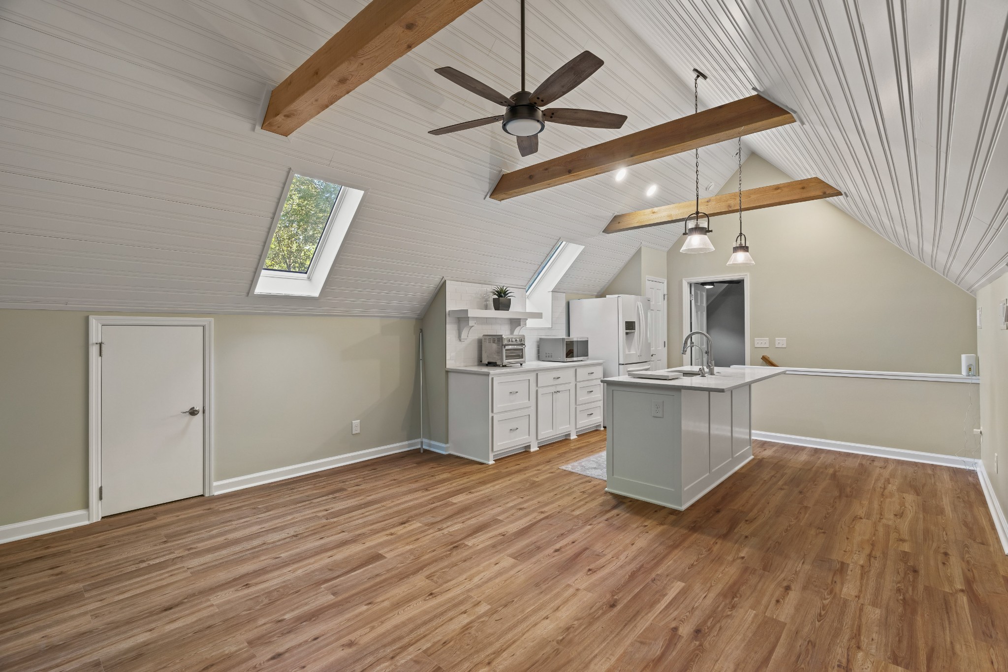 204 Hidden Lake Road Hendersonville, TN 37075 - Photo 52 of 67 a kitchen with cabinets wooden floor and a ceiling fan