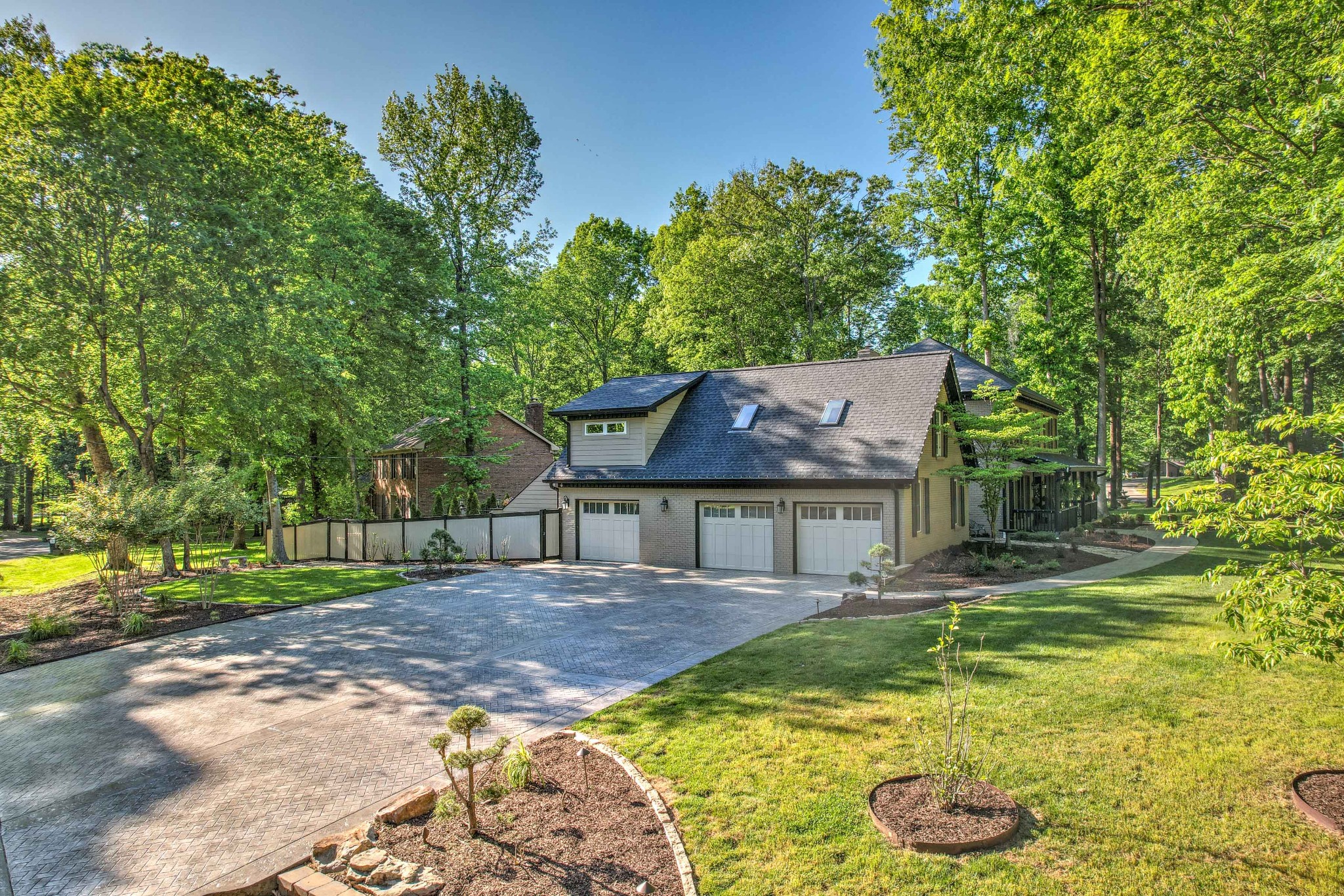 204 Hidden Lake Road Hendersonville, TN 37075 - Photo 8 of 67 a front view of a house with a yard table and chairs