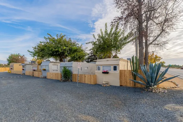 a view of a car park in front of house