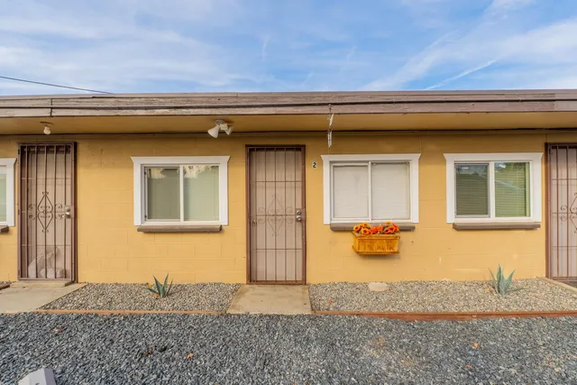 a backyard of a house with oven and entertaining space