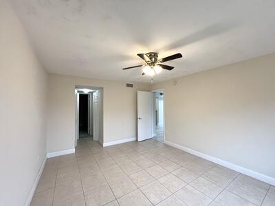 4215 North University Drive, Unit 214 Sunrise, FL 33351 - Photo 16 of 24 an empty room with fan and windows