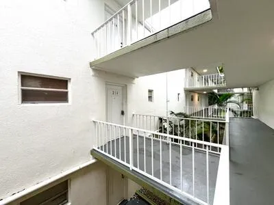 a view of balcony with furniture