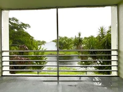 a view of outdoor space with wooden floor