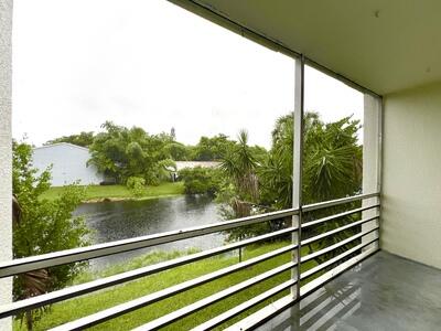 4215 North University Drive, Unit 214 Sunrise, FL 33351 - Photo 23 of 24 a view of a balcony with lake view