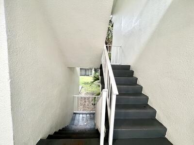 4215 North University Drive, Unit 214 Sunrise, FL 33351 - Photo 3 of 24 a view of entryway and hall with wooden floor