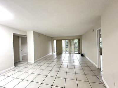 4215 North University Drive, Unit 214 Sunrise, FL 33351 - Photo 8 of 24 a view of an empty room and window