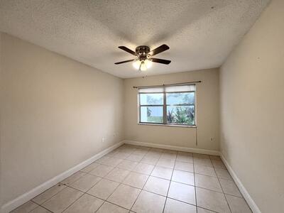 4215 North University Drive, Unit 214 Sunrise, FL 33351 - Photo 9 of 24 a view of an empty room with a window