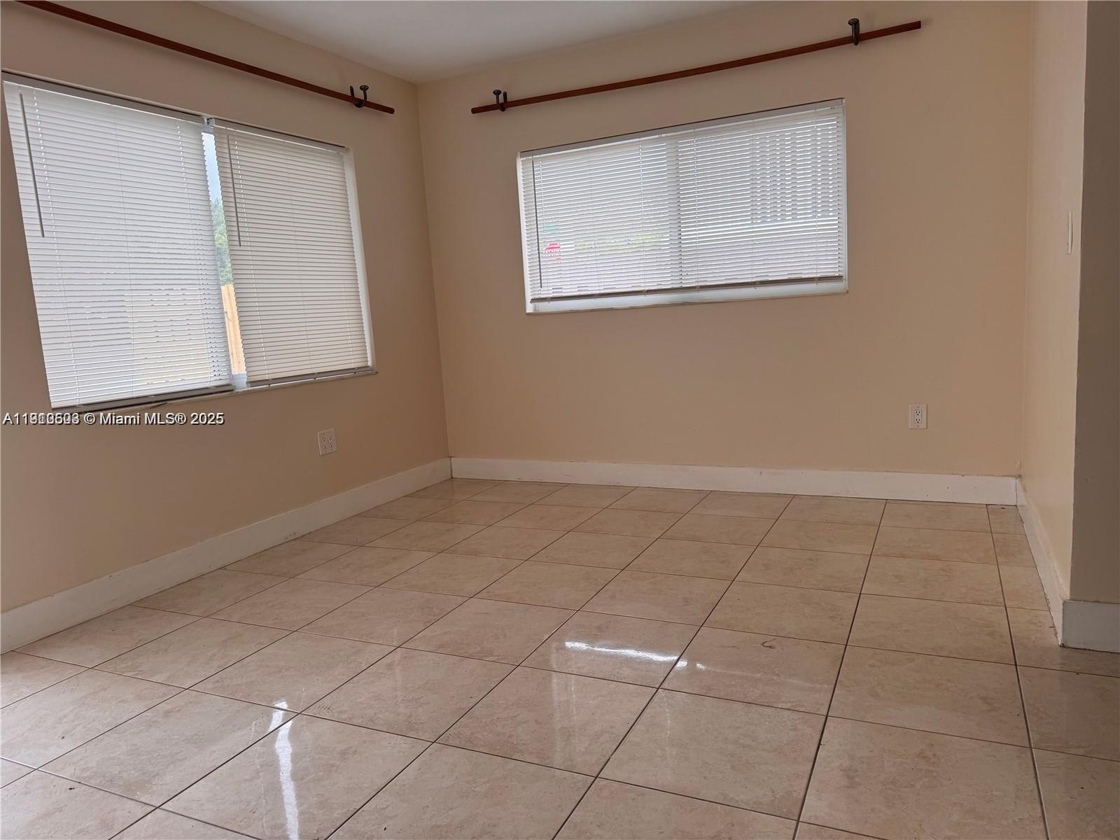 13455 Arch Creek Road North Miami, FL 33181 - Photo 3 of 5 a view of a room that has a window in it