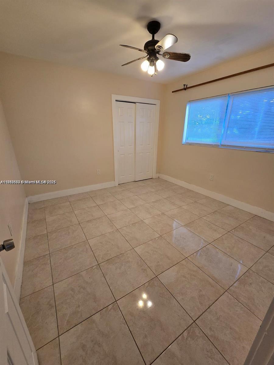 13455 Arch Creek Road North Miami, FL 33181 - Photo 4 of 5 a view of an empty room with a window