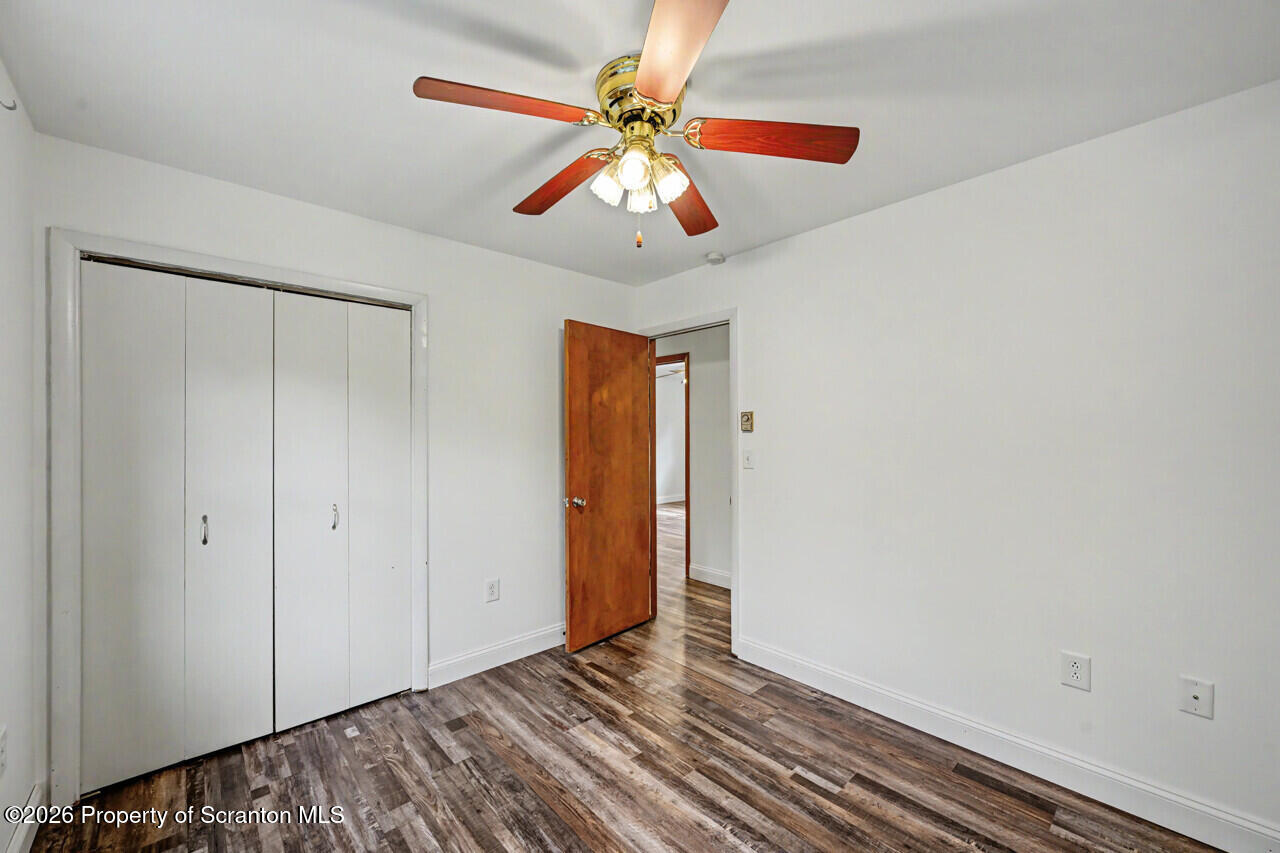 211 Buckingham Street Moscow, PA 18444 - Photo 52 of 83 a view of an empty room with window and wooden floor