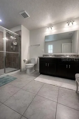 a bathroom with a sink vanity and tub