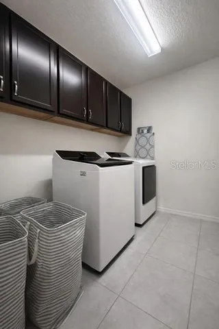 a kitchen with stainless steel appliances granite countertop a sink and a stove