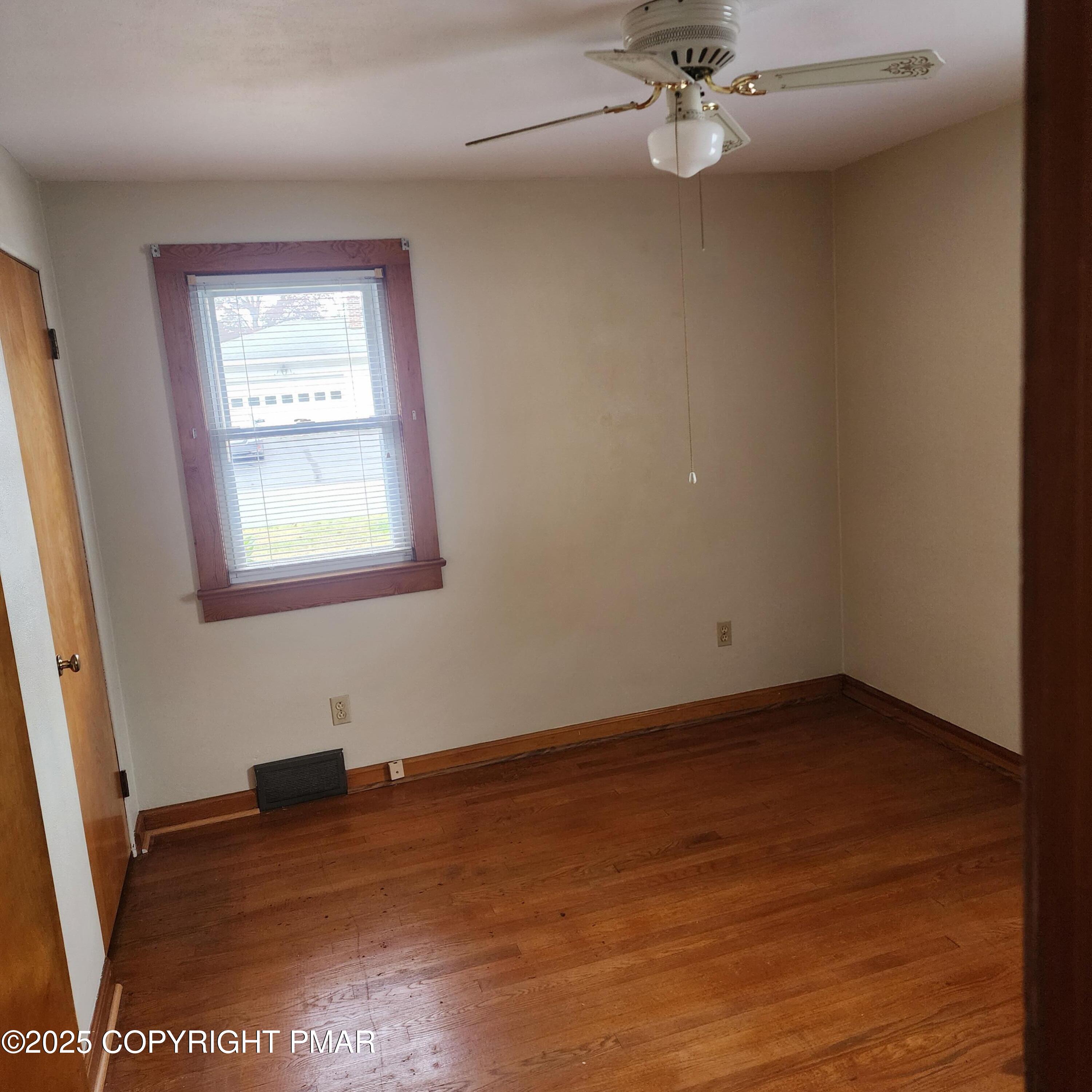 1069 Fritz Avenue Stroudsburg, PA 18360 - Photo 13 of 14 wooden floor in an empty room with a window
