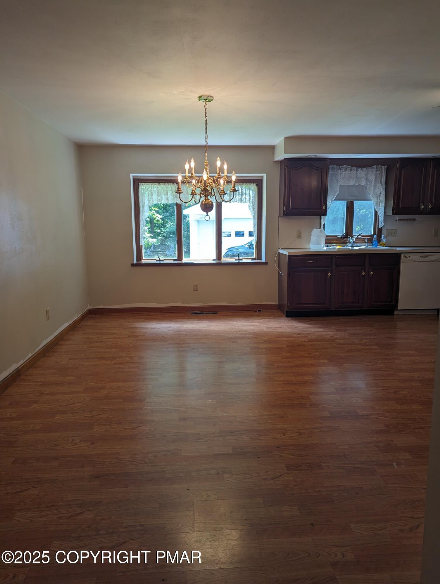 1069 Fritz Avenue Stroudsburg, PA 18360 - Photo 7 of 14 a view of kitchen and dining room with furniture window and outdoor view