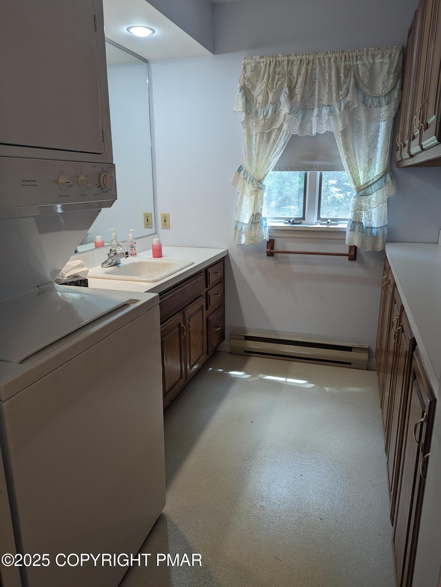 1069 Fritz Avenue Stroudsburg, PA 18360 - Photo 8 of 14 a kitchen with kitchen island a sink a stove and a chandelier