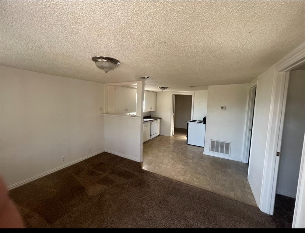 3133 Tbd County Road Lone Oak, TX 75453 - Photo 12 of 21 Open-concept living space featuring a partial wall dividing the kitchen area