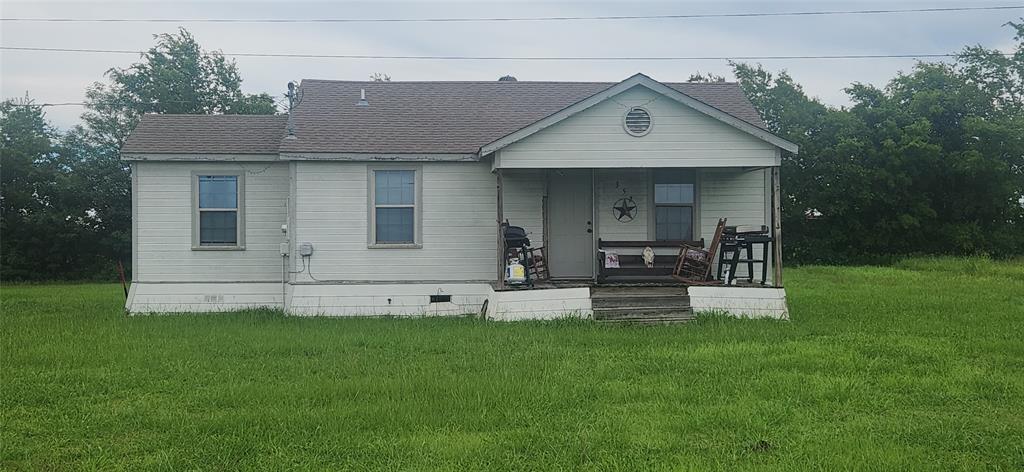 3133 Tbd County Road Lone Oak, TX 75453 - Photo 2 of 21 Single-story residence featuring light-colored siding, a covered front porch, and a gabled roof